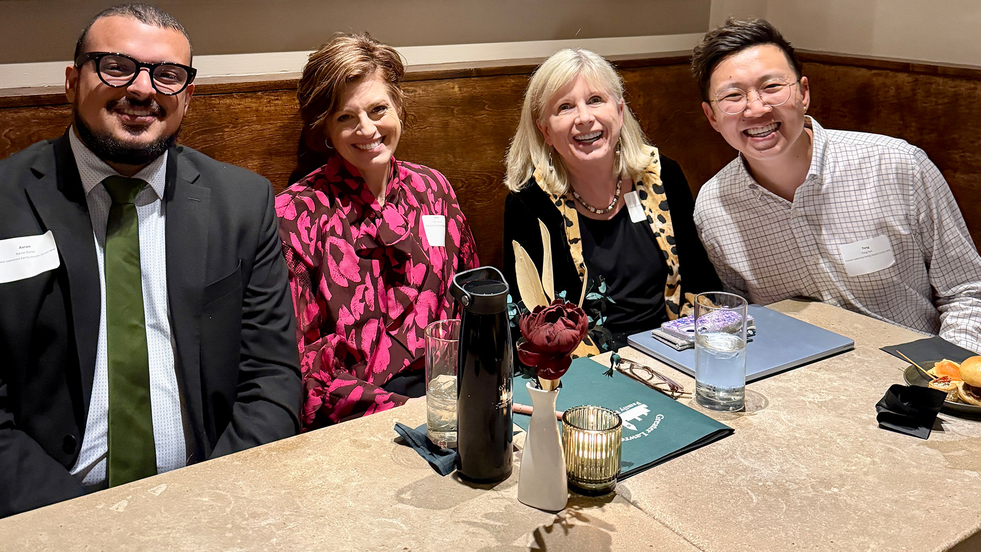 Four GLFHC staff sit at a table in the Capitol building.